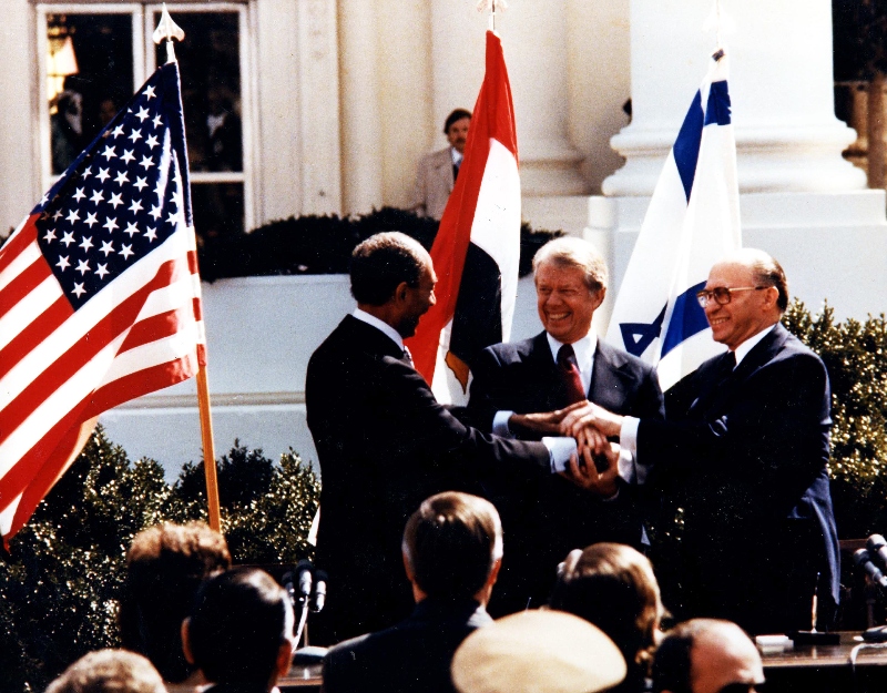 Jimmy-Carter shaking hands with Menachem Begin and Anwar Sadat on the White House lawn in 1979